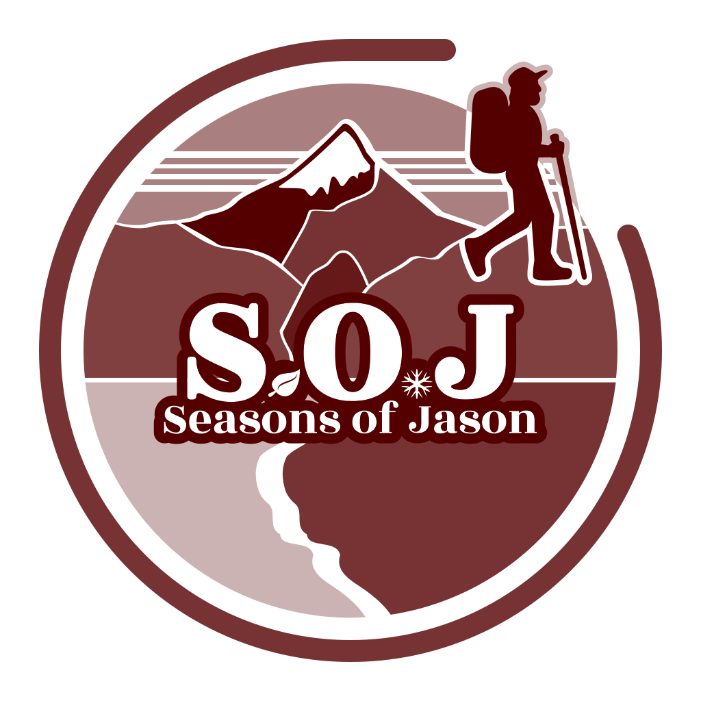 A circular logo for “Seasons of Jason” featuring a stylized hiker with trekking poles walking beside a mountain range. Below the hiker and mountains is a bold “S O J” with a leaf and snowflake integrated into the lettering. The full name “Seasons of Jason” appears beneath the abbreviation. A winding white trail leads from the bottom of the circle upward toward the horizon, symbolizing a journey. The color palette consists of earthy autumn tones — primarily browns and reds — evoking a retro national park aesthetic.